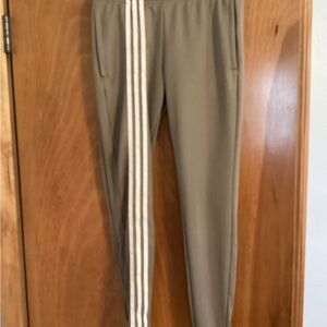 Adidas women’s Tan Track Pants with White Stripes.